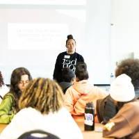 Girls of Color Summit previous event where people are sitting listening to a women speak